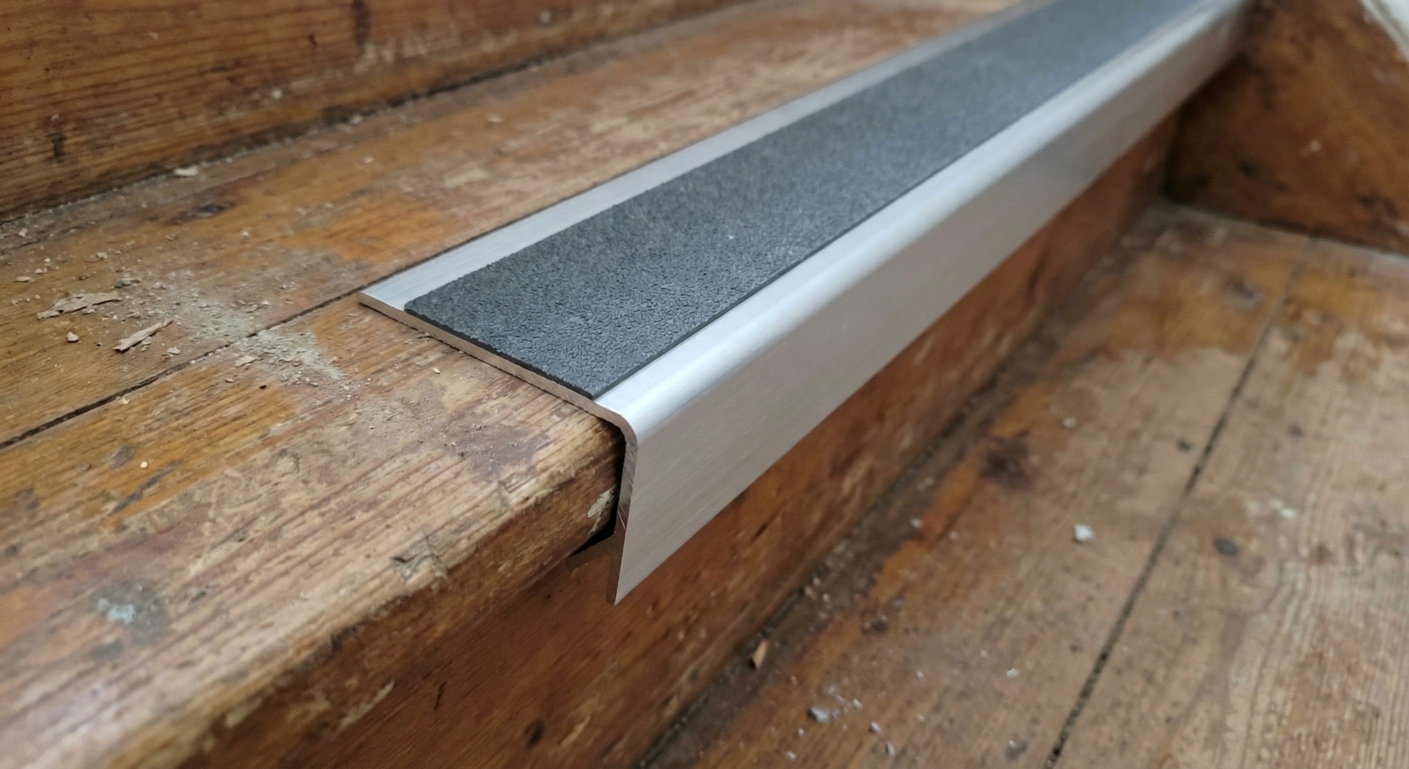 Premium aluminium non-slip stair nosing installed on UK commercial stairs