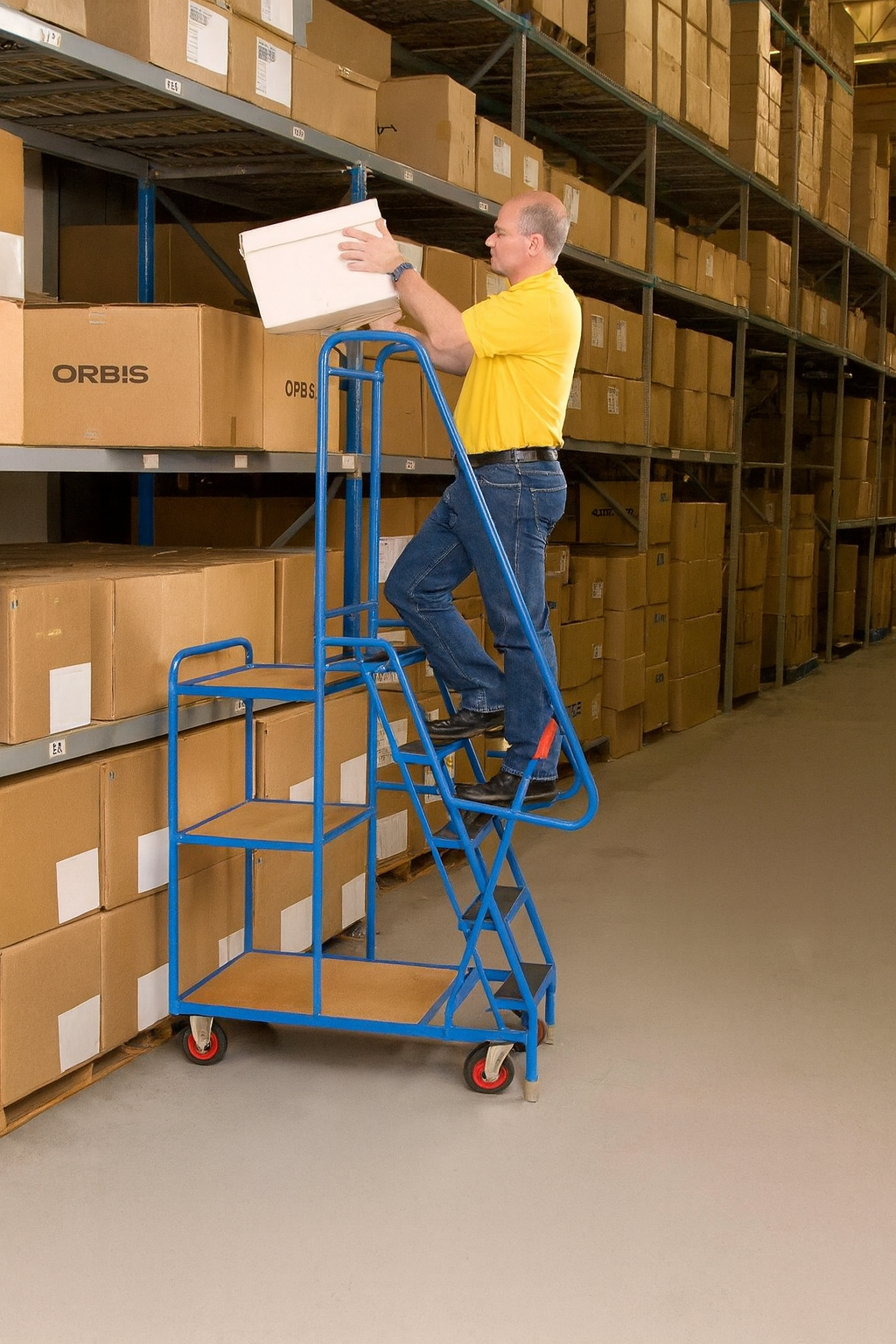 Mobile warehouse order picking trolley UK with integrated steps and guard rail